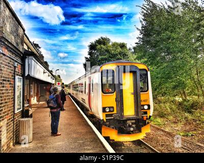 Passenger train arriving at Melton on the 49-mile East Suffolk branch line from Lowestoft to Ipswich, Suffolk, England. Stock Photo