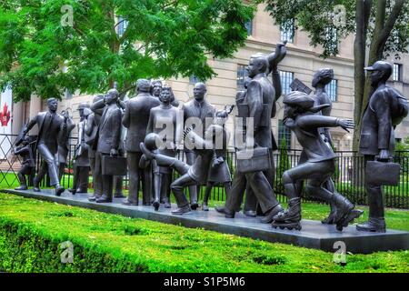 Community (2001) 21 bronze life size sculpture figures by Kirk Newman, Bloor St East, Toronto, Canada Stock Photo