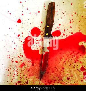 Sharp knife with blood splatter concept