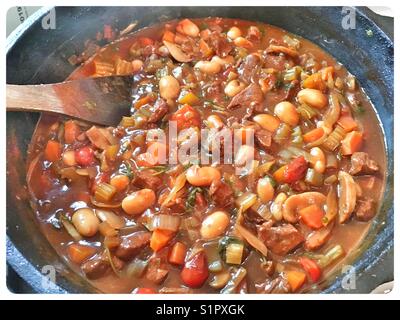 Dutch Oven containing beef and bean stew. Stock Photo