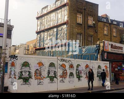 Building site with artistic graffiti on it, Peckham Rye Stock Photo