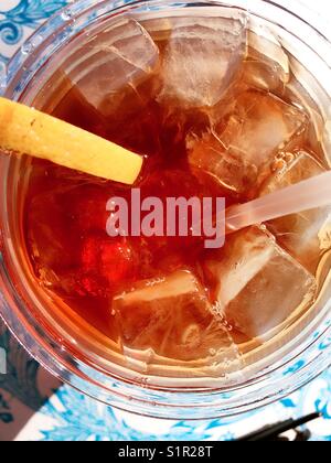 ice tea with slice of lemon in plastic cup on the wooden background Stock  Photo - Alamy