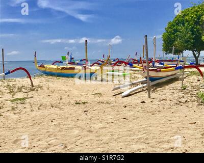 Colourful boats on the beach in Sanur, Bali Stock Photo