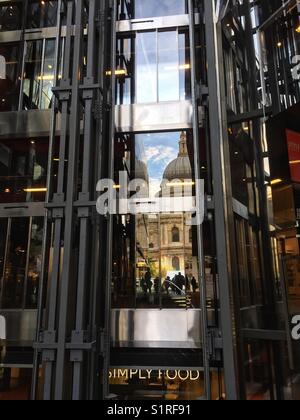 St Paul's Cathedral is seen reflected on the glass at 1, New Change owned by Land Securities in London, England Stock Photo