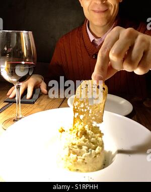 Man eating a typical tapa. Spain. Stock Photo