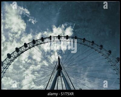 A grunge effect image of The London Eye or Millennium Wheel. This large A-Frame structure is Europe's largest Ferris Wheel & is next to The River Thames, near the Houses of Parliament. © COLIN HOSKINS Stock Photo
