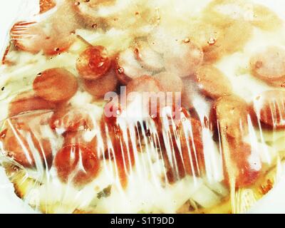 Frozen pepperoni and cheese pizza Stock Photo