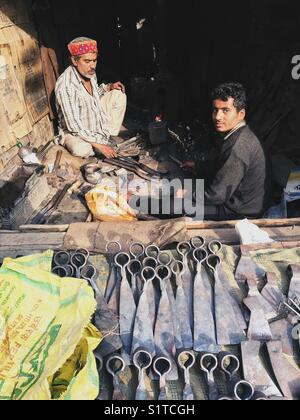 A black smith forging basic tools for farming. Stock Photo