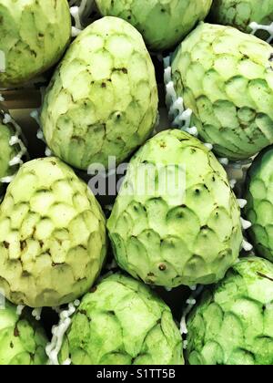 Custard apple, tropical fruits on market, Malaga, Spain Stock Photo