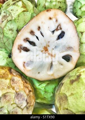 Custard apple, tropical fruits on market, Malaga, Spain Stock Photo