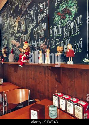 Wall blackboard with menu written in chalk, Christmas time in a Spanish snack-bar / restaurant. Stock Photo