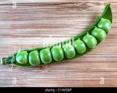 Fresh green peas in a pod. Stock Photo