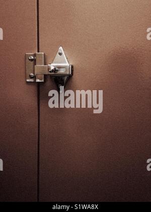 Metal public bathroom stall lock Stock Photo - Alamy