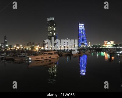 Souk Sharq marina reflecting city lights... Stock Photo