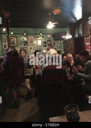 Night at the pub. Punters waiting for service at the Kings Head Theatre Pub in Islington. Stock Photo