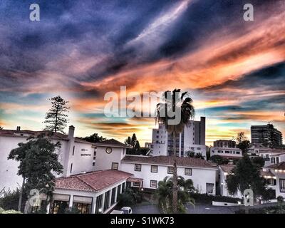 Sunset sky over a hotel and city buildings, Funchal, Madeira, Portugal Stock Photo