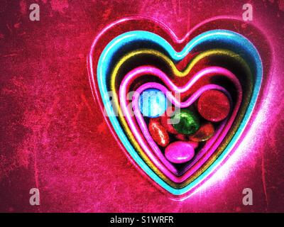 Colourful hearts with candy Stock Photo