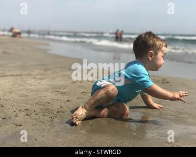 One year old baby on the beach La Grande Motte France Stock Photo