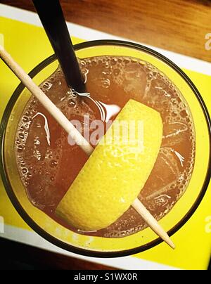 Iced tea with large lemon wedge Stock Photo