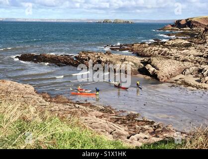 Sea kayaking at St Brides Pembrokeshire Stock Photo