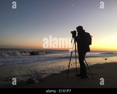Photographer taking pictures at spurn point Humberside England UK Stock Photo