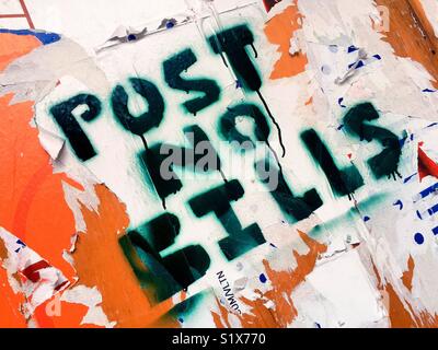 Post no bills sign painted over wooden wall covered with papers, New York City, USA Stock Photo