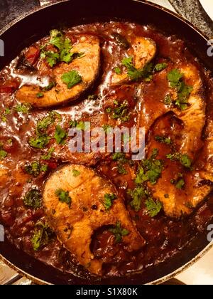 Home made Andhra Chepala iguru (fish curry) in a pan. Stock Photo