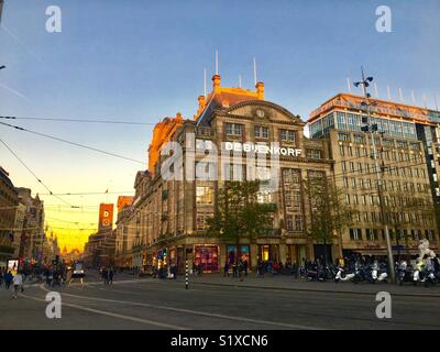 A photo of the famous Damrak street in Central Amsterdam, Netherlands Stock Photo