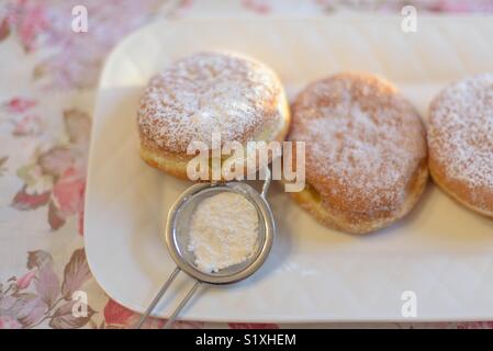 Traditional paczki pastries for Fat Tuesday or Paczki day Stock Photo
