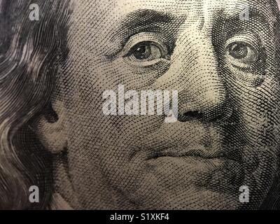 Up close look at the face of Benjamin Franklin on the front of a U.S. $100 bill. Stock Photo