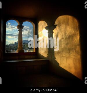The shadow of a window with two arches is cast in Museo de las Culturas de Santo Domingo convent in Oaxaca, Mexico Stock Photo