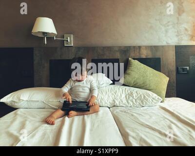 Baby boy using a digital tablet Stock Photo
