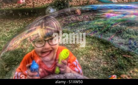 Big Bubble, Little Boy, Big Imagination Stock Photo