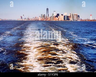 View of lower Manhattan skyline from the Staten Island ferry in New York Harbor, NYC, USA. Stock Photo