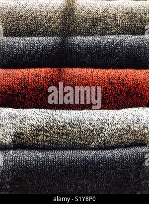 Abstract of quality folded coloured bath towels, stacked on top of each other. Stock Photo