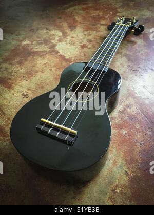 Black Ukulele. Stock Photo