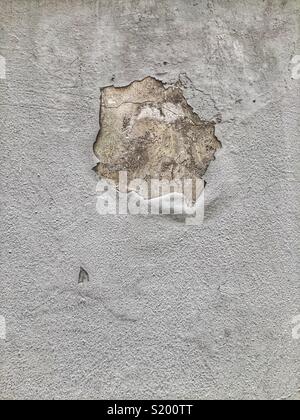 Textural abstract of peeling paint on cement render, Sai Ying Pun, Hong Kong Island Stock Photo