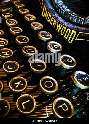 Close-up on an old Underwood typewriter with dust Stock Photo