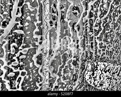 Soapy water on windshield at the car wash Stock Photo