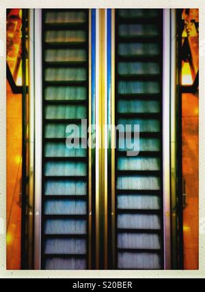 Looking down at an empty automatic stairs in a mall. Stock Photo