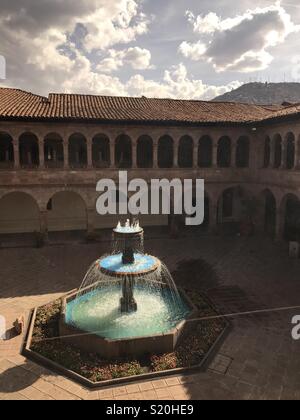 A drink by the fountain in the Spanish courtyard in Cusco Stock Photo