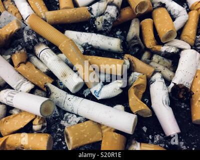 Close-up picture of Cigarette butts in an ashtray Stock Photo