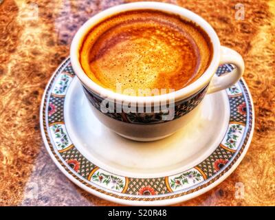 Cup of coffee, cafe con leche, on a table, high angle view Stock Photo