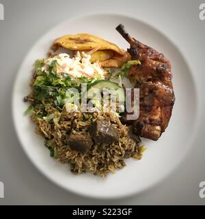 Goat/Mutton Curry and Jerk Chicken meal Stock Photo