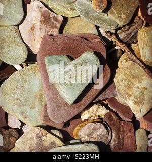Heart shaped stone, love on the rocks Stock Photo