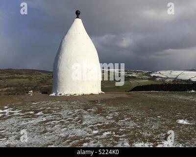 White Nancy hilltop monument in Bollington near Macclesfield, UK, on a snowy day Stock Photo