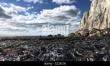 Dover’s White Cliffs look stunning from the beach on a crisp winter morning. Stock Photo