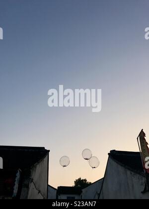 Balloons in between buildings in Suzhou, Jiangsu province, China Stock Photo