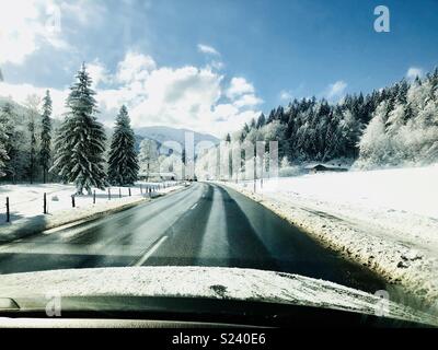 Road through Winter Wonderland with snowcovered Trees Stock Photo