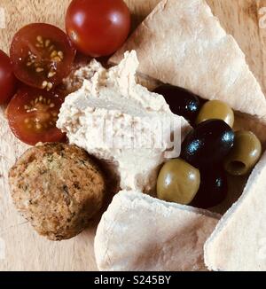 Houmous and pitta with olives and falafel Stock Photo